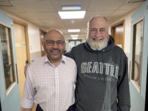 Mr Syed Hyder (left) and Mr Kevin Root (right) standing in the corridor