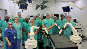 The surgical team at The QEH beside the new robot