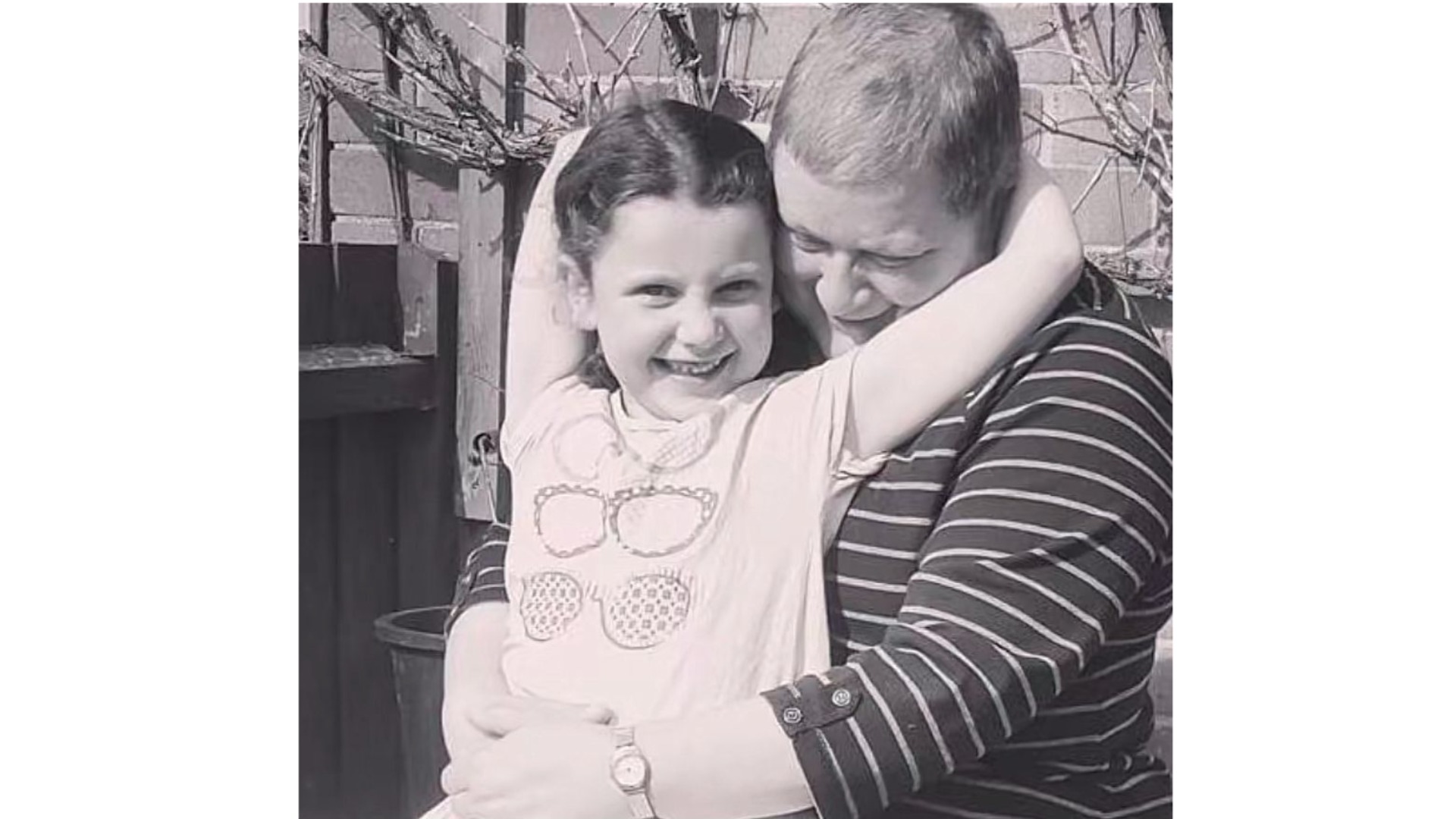 A picture of Chloe as a child hugging her grandma